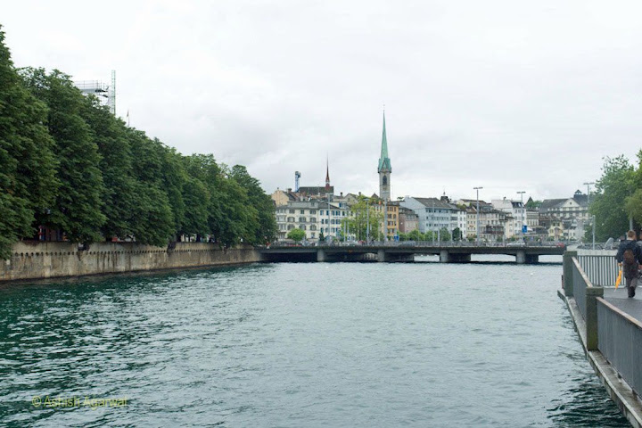 View of the river Limmat in Zurich, with the background of a number of good looking buildings, in Switzerland