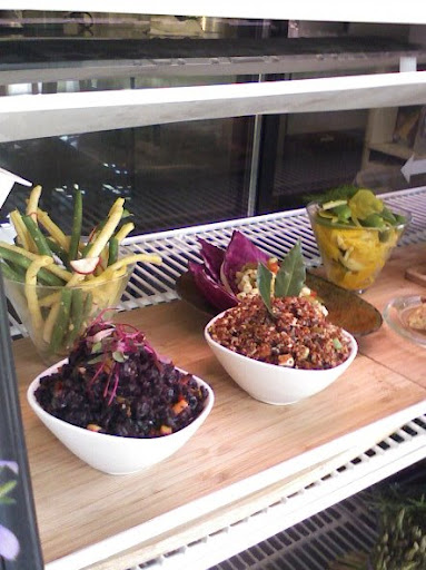 Freshly prepared Black Rice with Ginger and Carrots, Red Quinoa Salad, Shaved Golden Beets and Edamame, and Sesame Green and Yellow String Beans