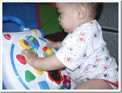 Liam plays with walker