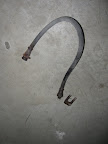 The rubber brake hose that connects the axle to the brake line that runs the length of the trailer frame. There was a stubborn U clip that finally came off with a lot of coaxing.