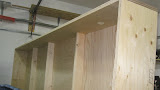 Internal roof cross members are just 1x4 pine with a slight arch cut on the upper side. All joints are glued as well as screwed/nailed.