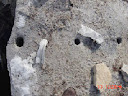 holes drilled on concrete ready for chemical bursting