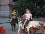 Mollie and Josh on a pony ride in our courtyard during Moon Festival celebrations