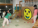 Sophey scoring big points at the bean bag toss, run by Sandy and Daphne