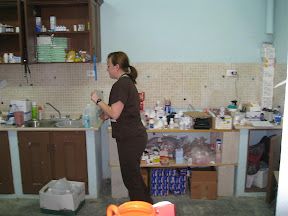 Mixing antibiotics for a sick patient.