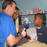 Bud Neeley, our dentist for the week, talking to one of the students, with Johan translating.