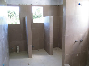Bathroom stalls and showers to accommodate large groups.
