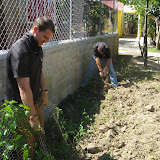 Chris and Charlie working to make the garden behind the school functional.