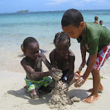 Ricardo, Son and David building a sand.... blob?