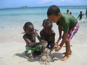 Ricardo, Son and David building a sand.... blob?