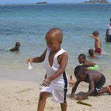 Jemsy, carrying water one spoonful at a time to his sand mountain.