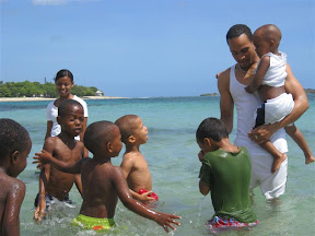 Willi, Elijio, Antony and David trying to convince Jemsy the water is a fun place to be.