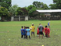 Daniel and Cakito praying with the kids before the final game.