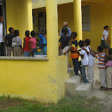 Johan and Kendall lead their first grade class into their room.
