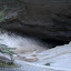 The huge mouth of the cavern.  Amy pictured at center.