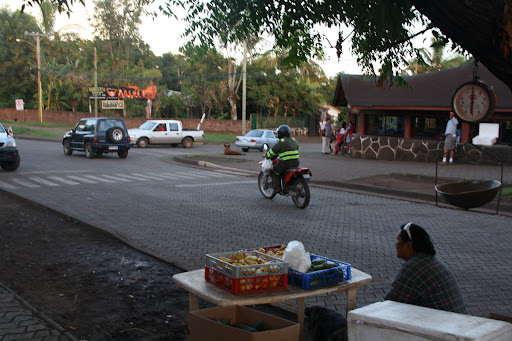 Locals shop for their produce early at the market and the truck vendors