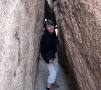 Coming through a narrow gap.