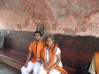 At a ghat (bathing area near river) in Haridwar, with Mom.