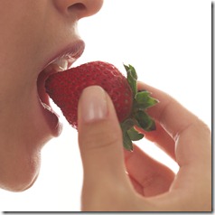 eating a strawberry eating a strawberry