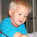 Op het grote bed