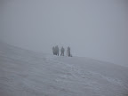 Morning of the climb. Talking to other climbers about conditions and their summit plan. They ended up bagging their summit attempt due to the bad weather and decided to head down.