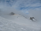 Weather starting to clear as we approach the saddle near the summit.