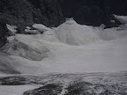 Look for a large boulder in the snowfield at about 10pm from center. I saw that vw sized boulder get hurled out there from above, so happy no one was below. Lots of stuff moving out there.