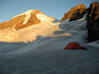 Basecamp below the Black Buttes. Summit route is through the glaciers to the saddle on the right, then up to the summit via the Roman wall.