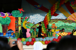kyle runs across the stage