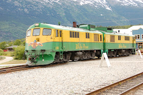 We're off the train now. This is the engine that was pulling us. It's a restored GE diesel-electric unit dating back to the 1950s. The White Pass & Yukon Route rail fleet consists of 20 diesel-electric locomotives from GE (1950s) and ALCO (1960s). They also have 80 restored or replica passenger coaches. The oldest coach is from 1883 and sees daily use on the line.