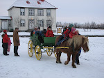 Einar Trausti riding in a horse carriage in the Museum (Árbæjarsafni)