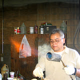 Francisco Heredia Master bronze caster working on a bronze patina