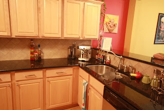 The west end of the kitchen (Sink, Expresso maker, faucets, Dishwasher)