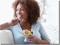 black-woman-eating-fruit-475x350