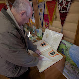 My father looks through a 1950s "facebook" of accomplished residents in Rozdolinsk at the Museum of Culture in Motygino