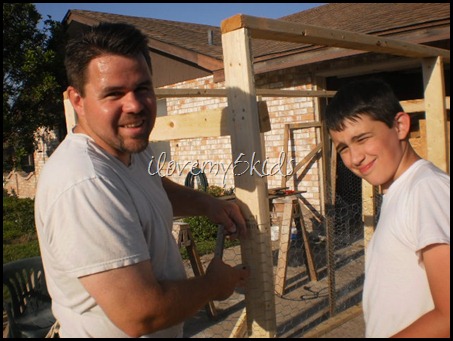 Father and Son Building Chicken Coop