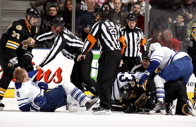2009/12/19 - Zdeno Chara ragdolls Mike Komisarek from a pile up after Johnny Boychuk