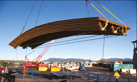 The last of 450 ‘wood wave’ panels being lifted into place