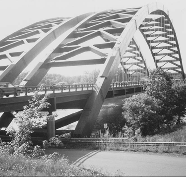 Twin steel through arches cross the Mohawk River in upstate New York
