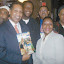 PROMO
TION: Magic Jack representative, Giddion Dunkley pres-ents Divine Diva, radio personality with a sample of the Magic Jack phone device at a promotional event held last Wednesday (February 6) at Mingles, Bronx. (l-r) Norris Gordon, Clive Spenser, Delroy Xiuines and Tony Cobb look on.