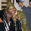 -Photo Credit: Ms. Raine of Ms. Raine Inc.
Looks like Richie Spice has gotten quite attached to 'The Plane
Land' music video director Rhona Fox--Rhona and the FOX
FLICKS production crew put in over 17 straight working hours to
get the video done and Richie has no problem showing his
appreciation.
