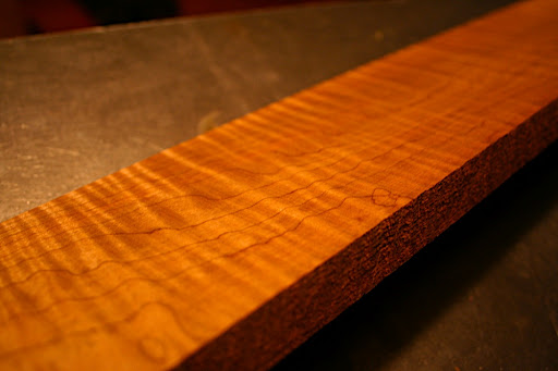 We picked up a piece of roasted flamed maple, big enough to do at least one multi-laminate neck, fretboard and headstock. Roasting the maple in an autoclave at high pressure and in a near vacuum changes the cellular structure of the wood, making it nearly impervious to moisture, but without changing its fundamental strength or tonal properties.