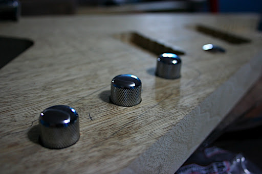 2010.01.21 Update: The controls have been positioned and recesses for the knobs drilled out. This guitar will use a blend pot in lieu of a toggle for the pickups, master volume, master tone and a kill switch.