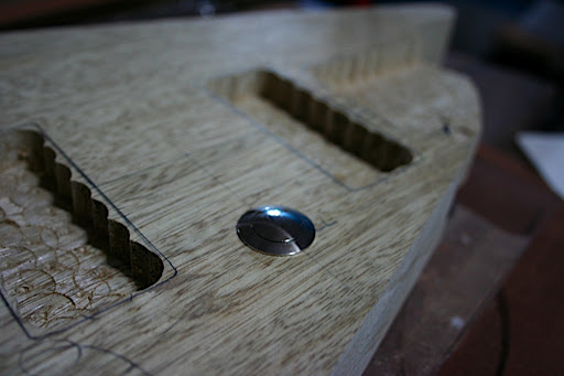 The kill switch is beautiful, industrial-strength and very low profile. It's been mounted between the pickups, just below the strings, so it will be easy to press while playing, but will be out of the way enough to avoid accidental presses.