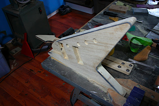 The excess glue and tape residue was also scraped and sanded off. More sanding will be done in the paint prep stage. The plan is for this guitar to be painted white, with black binding.