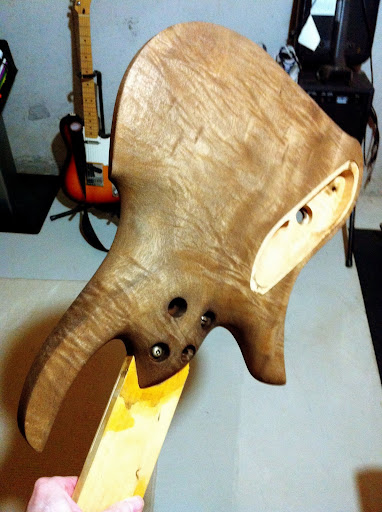 The back is as wild as the front. More even distribution of figure, but not as extreme as the front.
