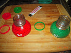 Sliced tops off bottles, removed cap rings whole.