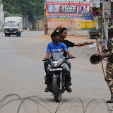 People showing their curfew pass to enter the curfew-bound area in Hyderabad's old city on Tuesday.