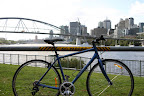 My bike with the Victoria Bridge and downtown Brisbane