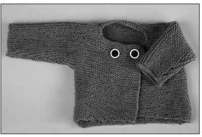 This baby sweater is knit all in one piece.